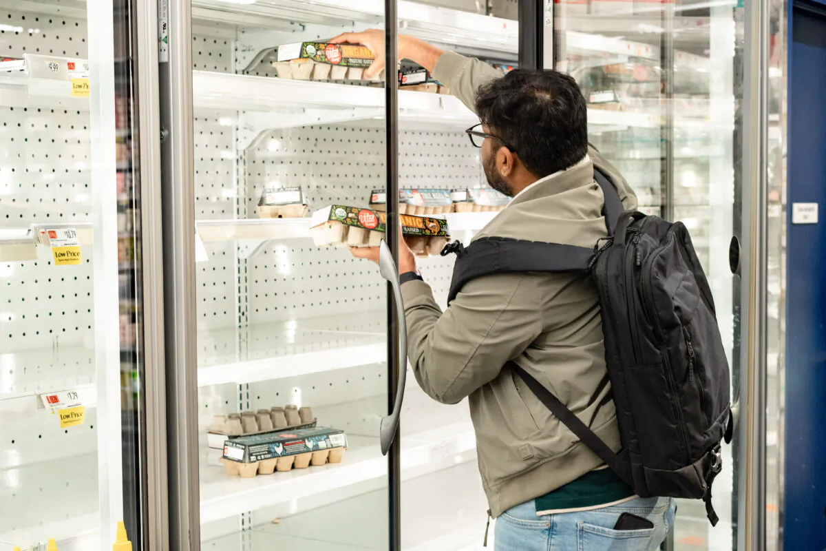 A man shops at a grocery store with an egg shortage in New York City on March 12, 2025. (Samira Bouaou/The Epoch Times)