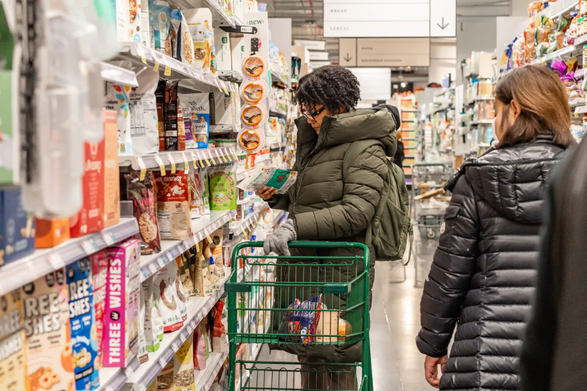 People shop at a grocery store in New York City on March 12, 2025. (Samira Bouaou/The Epoch Times)