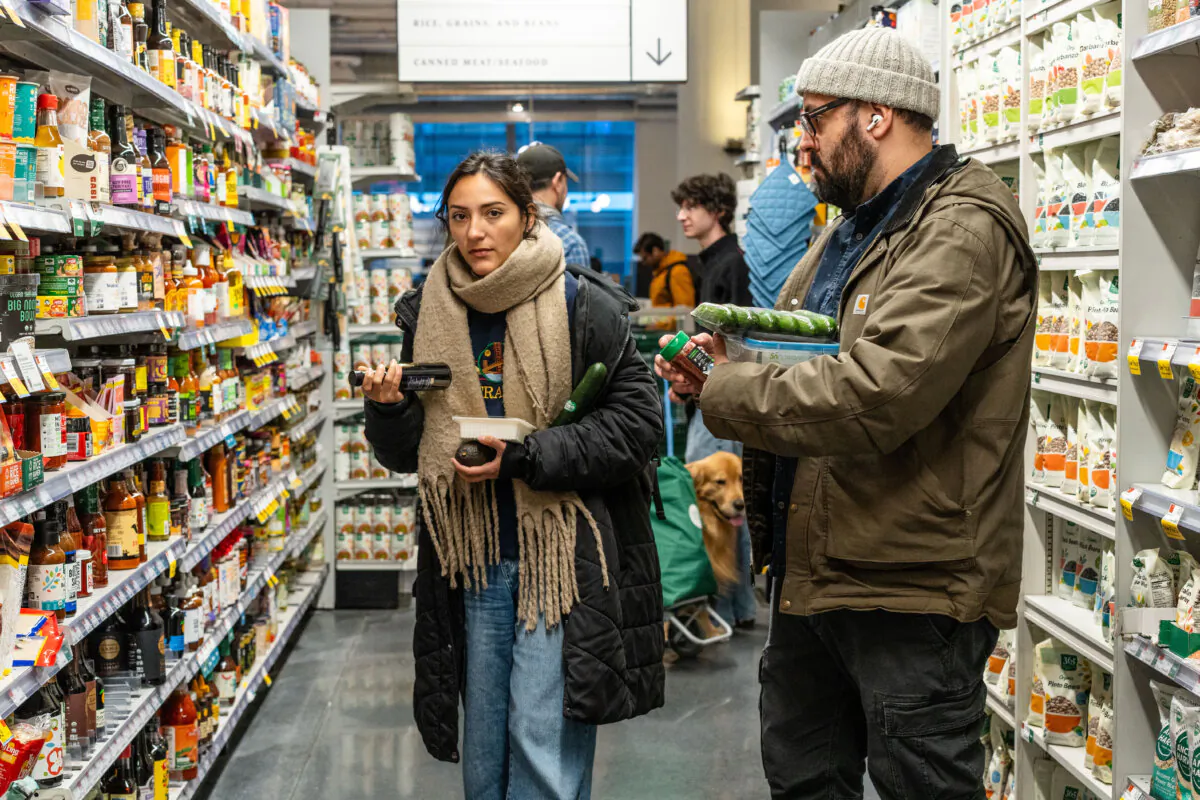 People shop at a grocery store in New York City on March 12, 2025. (Samira Bouaou/The Epoch Times)