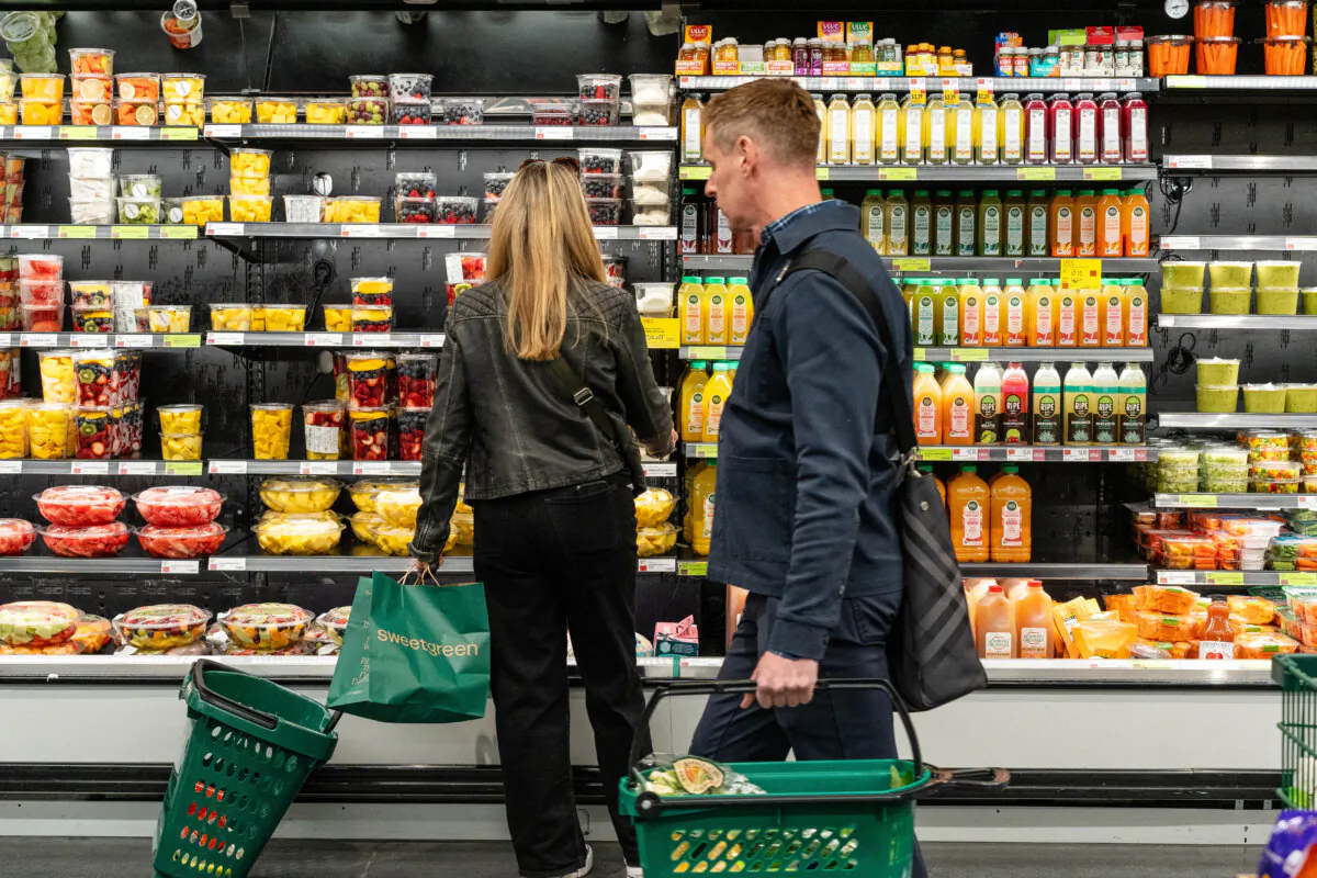 People shop at a grocery store in New York City on March 12, 2025. (Samira Bouaou/The Epoch Times)