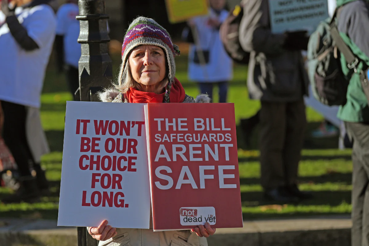 People take part in a demonstration to oppose the Terminally Ill Adults (End of Life) Bill at Old Palace Yard in Westminster, London on Nov. 29, 2024. (Yui Mok/PA Wire)