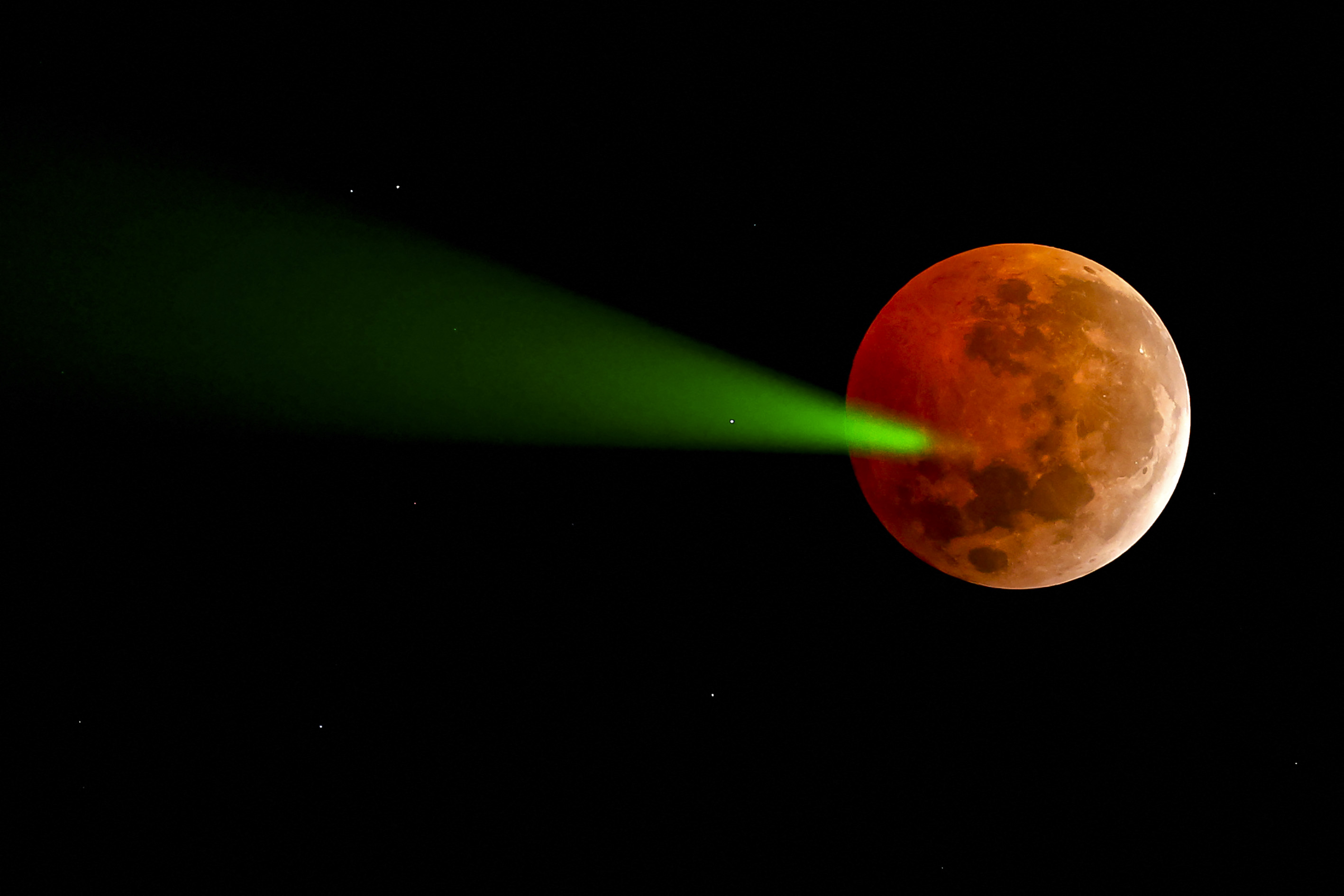 Day in Photos: Full Moon Eclipse, SpaceX Rocket Launch, and Java Flood