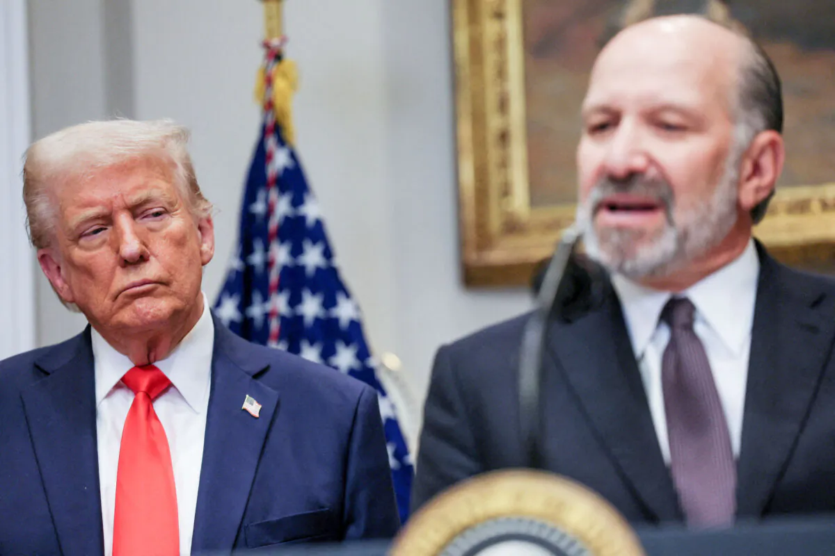 U.S. Commerce Secretary Howard Lutnick speaks next to U.S. President Donald Trump, as they make an announcement at the White House in Washington on March 3, 2025. (Leah Millis/Reuters)