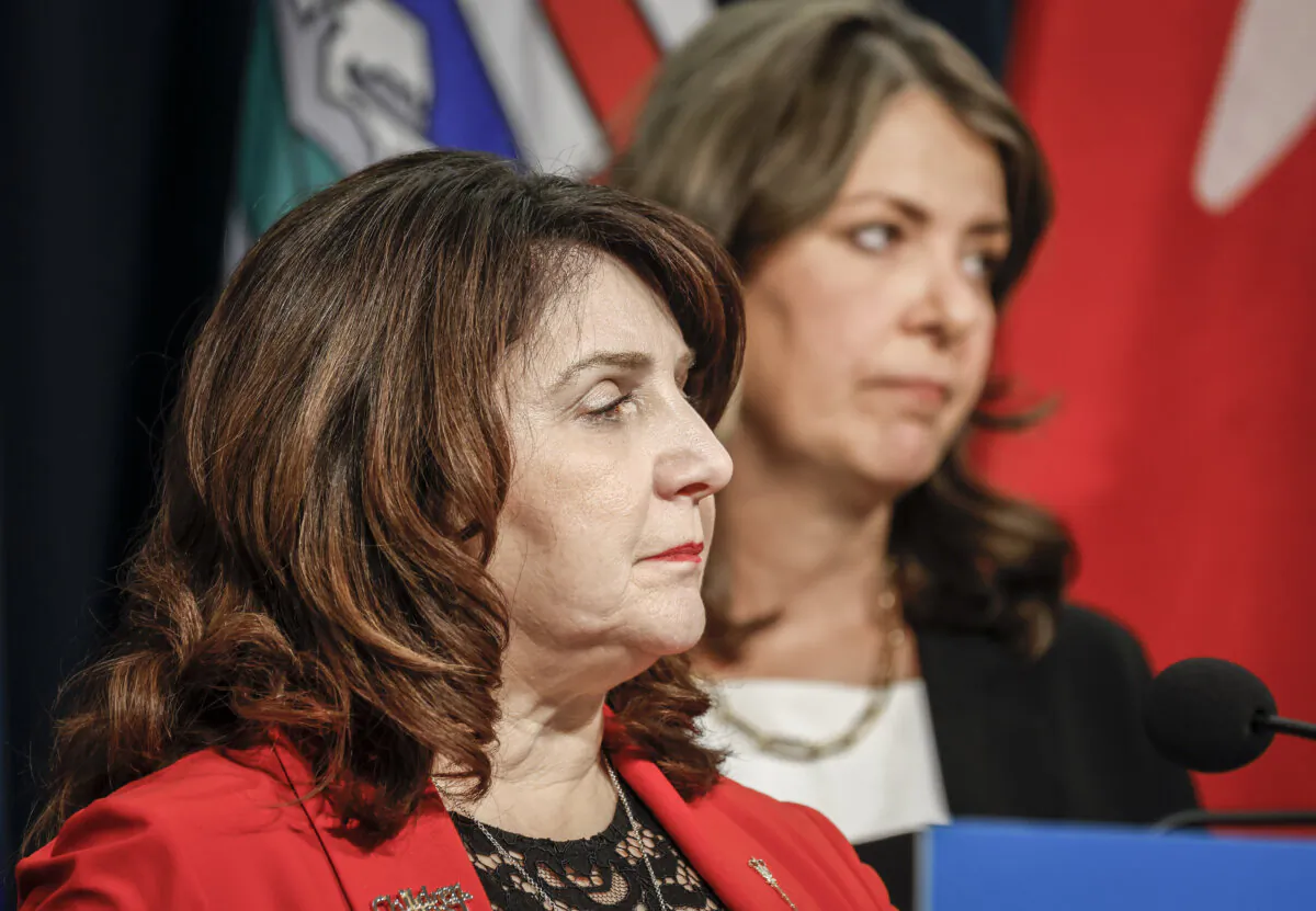 Alberta Premier Danielle Smith, right, and Minister of Health Adriana LaGrange provide an update on what steps the government is taking related to allegations by former Alberta Health Services CEO Athana Mentzelopoulos, in Calgary on Feb. 19, 2025. (Jeff McIntosh/The Canadian Press)