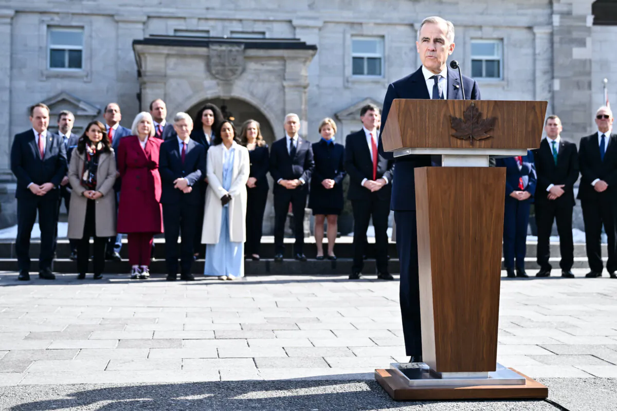 Mark Carney addresses the media, with his cabinet in the background, shortly after being sworn in as Canada’s 24th prime minister in Ottawa on March 14, 2025. (Minas Panagiotakis/Getty Images)