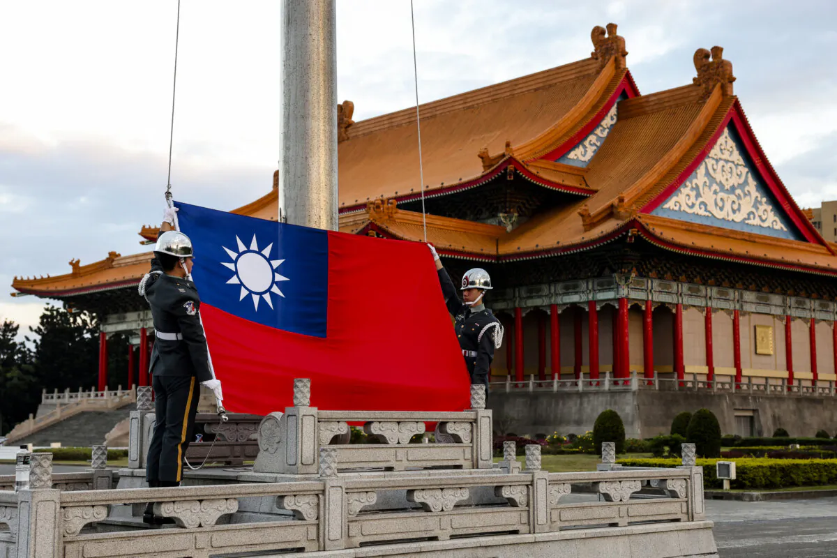 Guards raise Taiwan's national flag on the Democracy Boulevard at the Chiang Kai-shek Memorial Hall in Taipei on Nov. 29, 2024. (I-Hwa Cheng/AFP via Getty Images)