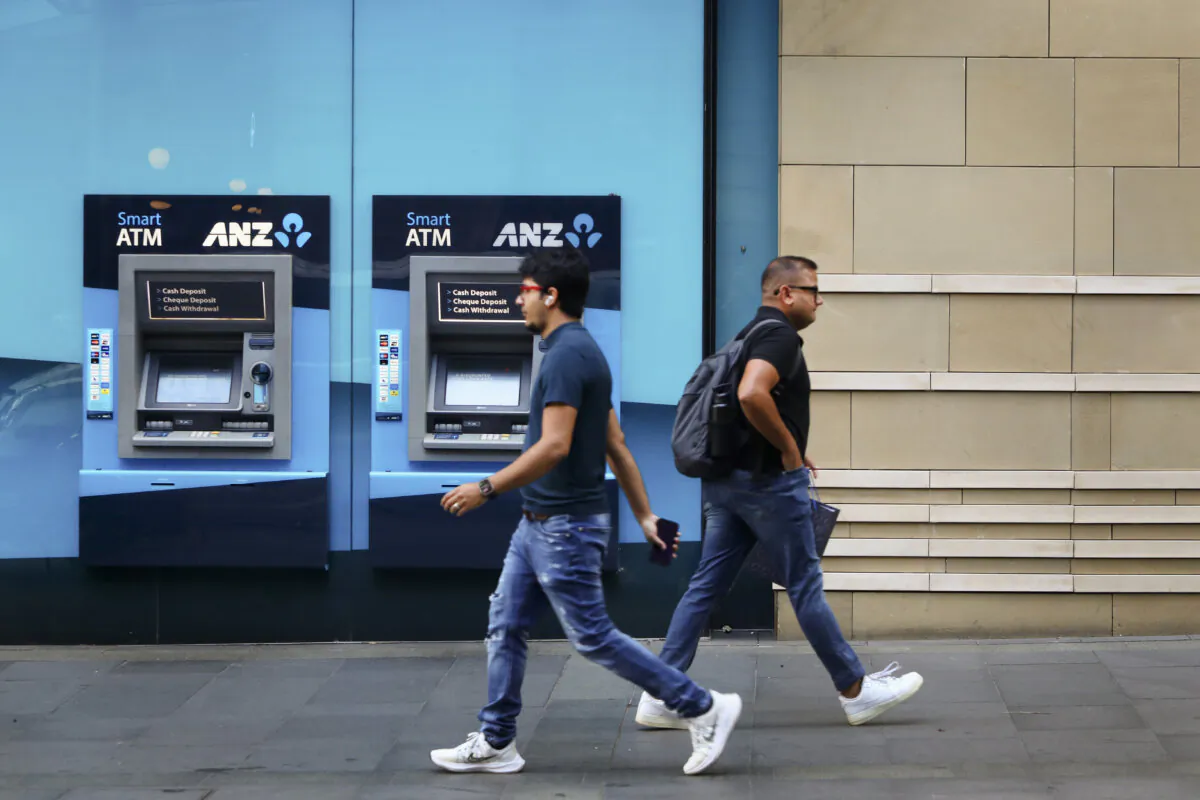 Pedestrians walk past an Australia and New Zealand Banking Group Ltd. (ANZ) branch in Sydney, Australia on Feb. 26, 2024. (Lisa Maree Williams/Getty Images)