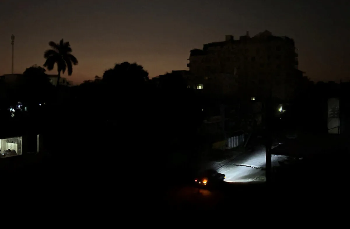 Car lights illuminate a street during a general blackout in Havana, Cuba, on March 14, 2025. (Yamil Lage/AFP via Getty Images)