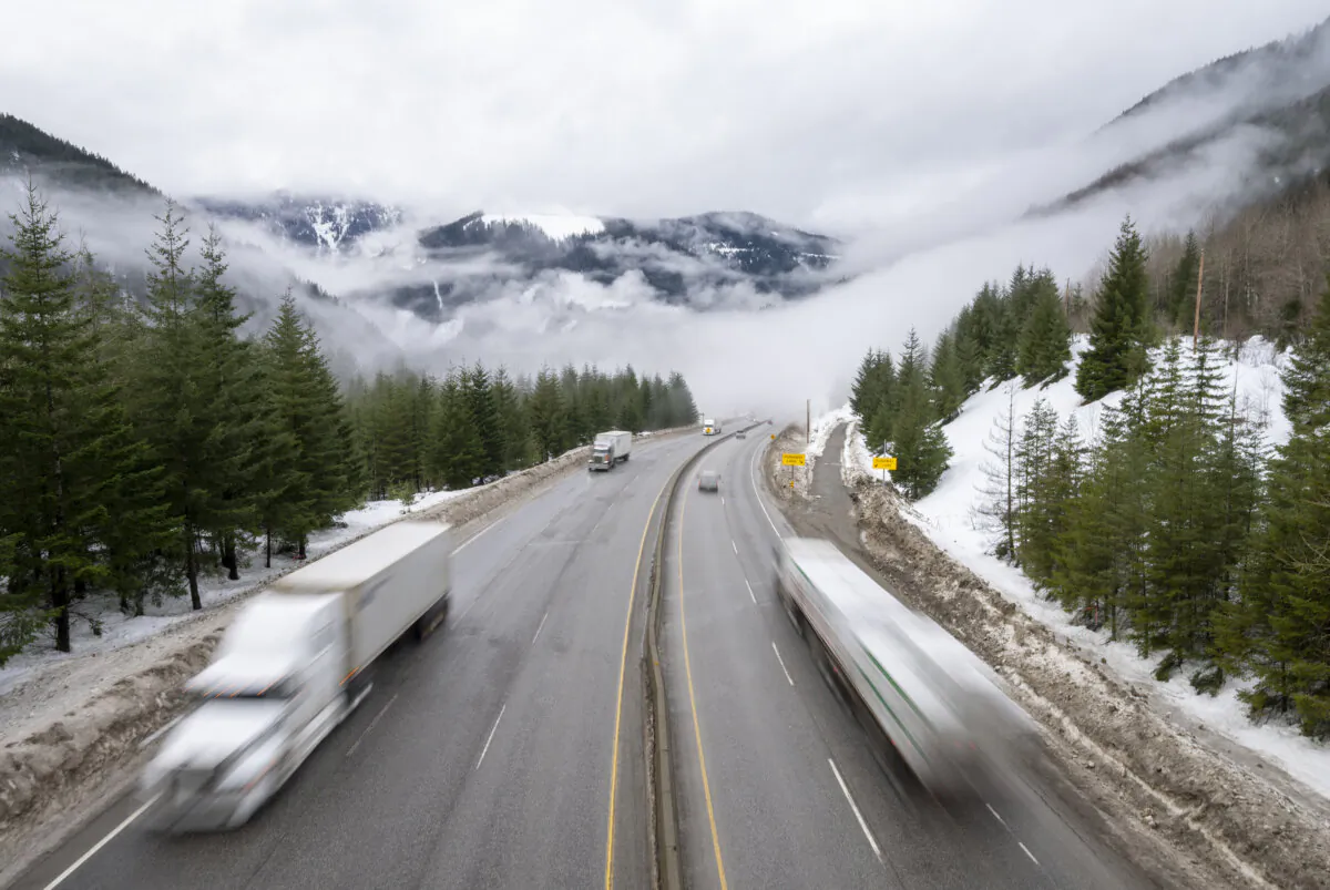 Vehicles are seen as they drive along the Coquihalla Highway on Jan. 19, 2022. (The Canadian Press/Jonathan Hayward)