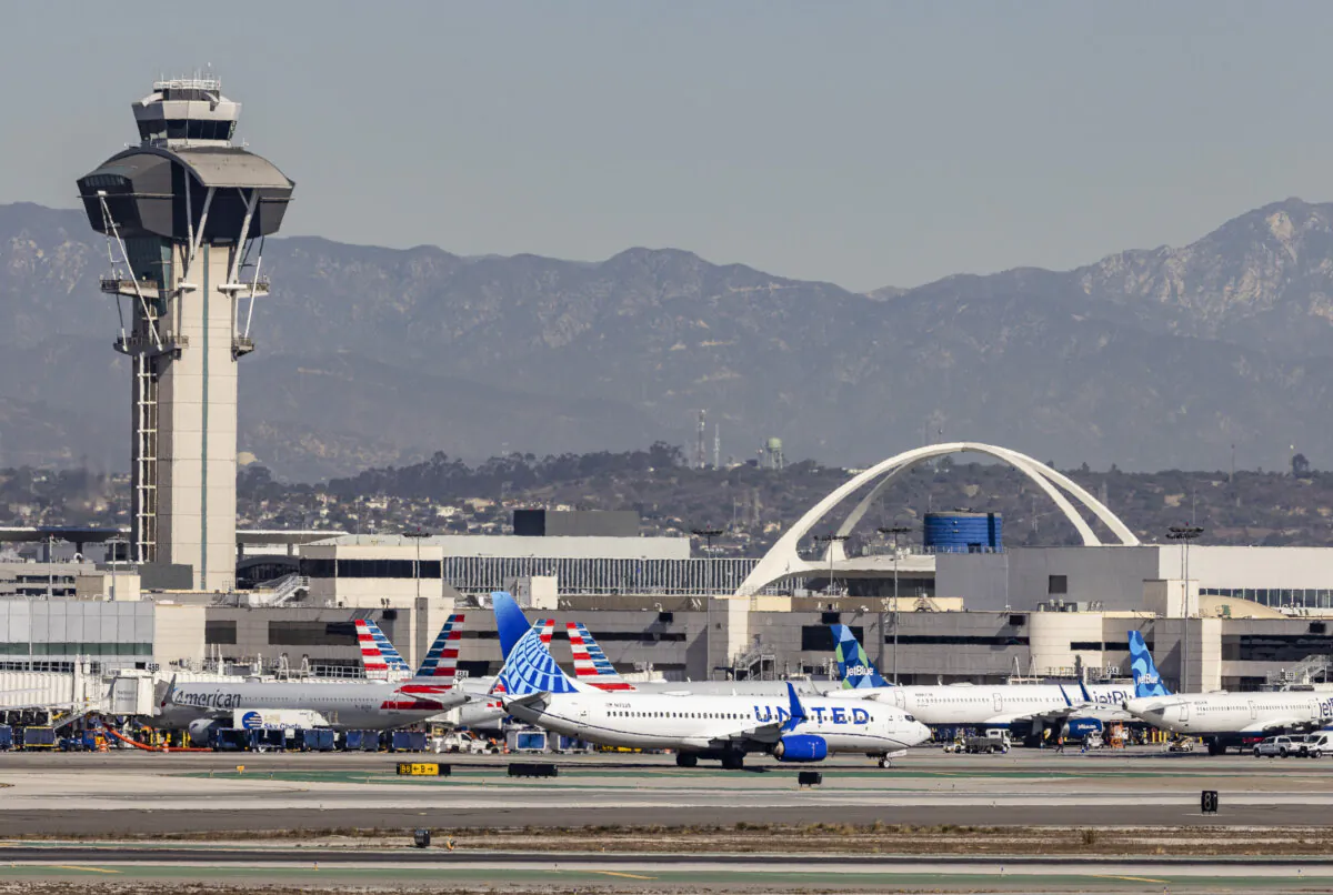 Passenger jets taxi at the LAX airport in Los Angeles on Nov. 21, 2024. (John Fredricks/The Epoch Times)