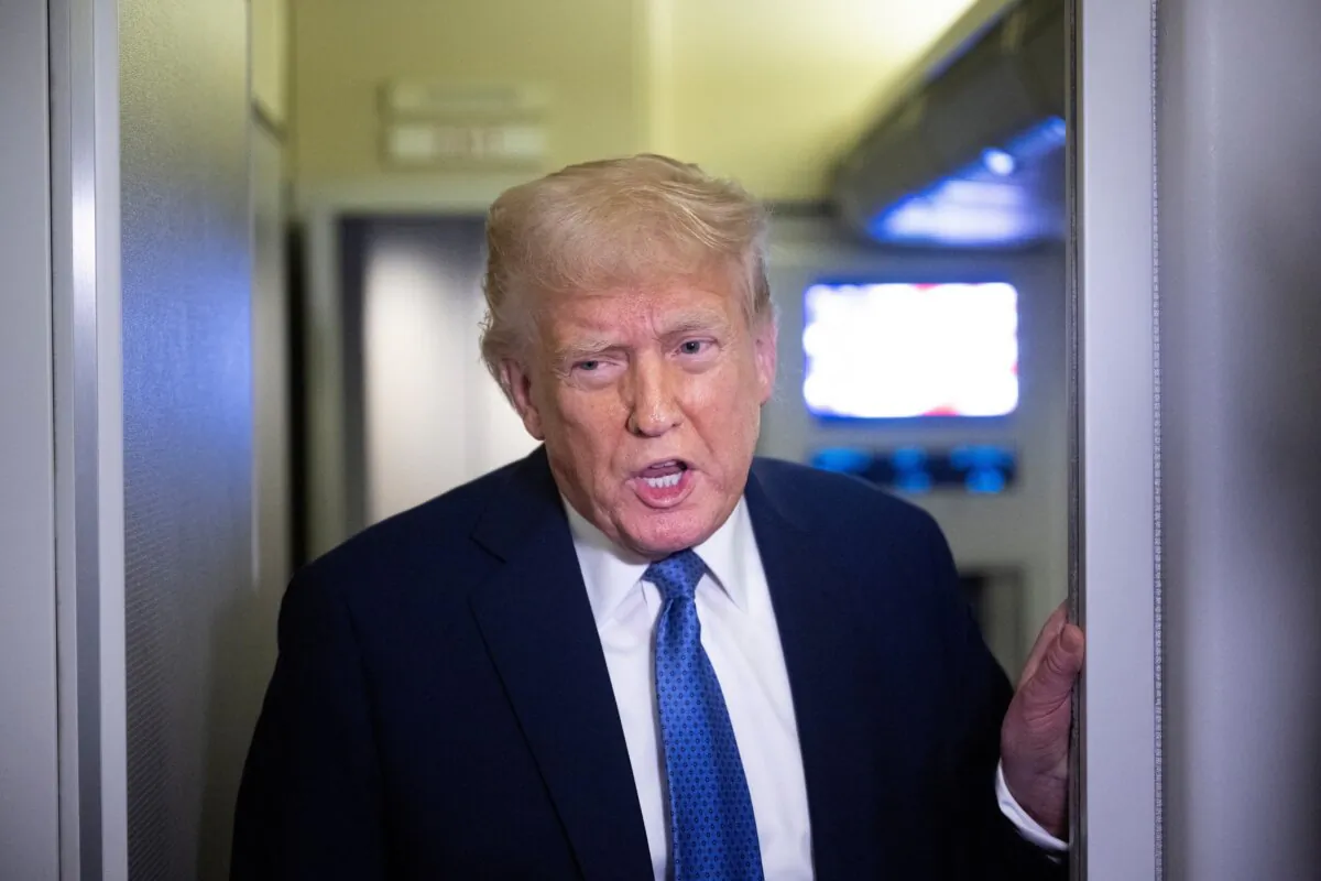 President Donald Trump speaks to reporters aboard Air Force One on March 16, 2025. (Brendan Smialowski/AFP via Getty Images)