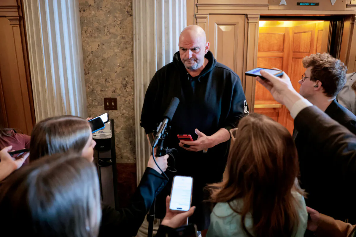 Sen. John Fetterman speaks to reporters outside the Senate Chambers on March 13, 2025. (Anna Moneymaker/Getty Images)