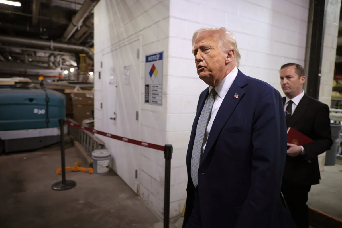 President Donald Trump tours water damage in the power control room during a guided tour of the John F. Kennedy Center for the Performing Arts and leads a board meeting in Washington on March 17, 2025. (Chip Somodevilla/Getty Images)