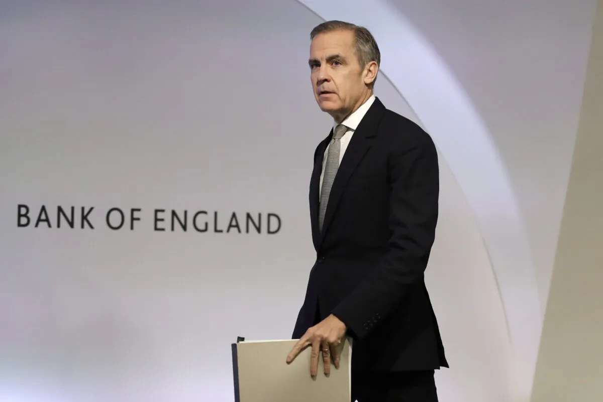 Mark Carney, then the Governor of the Bank of England, arrives for a press conference in London on Dec. 16, 2019. (AP Photo/Kirsty Wigglesworth,pool)