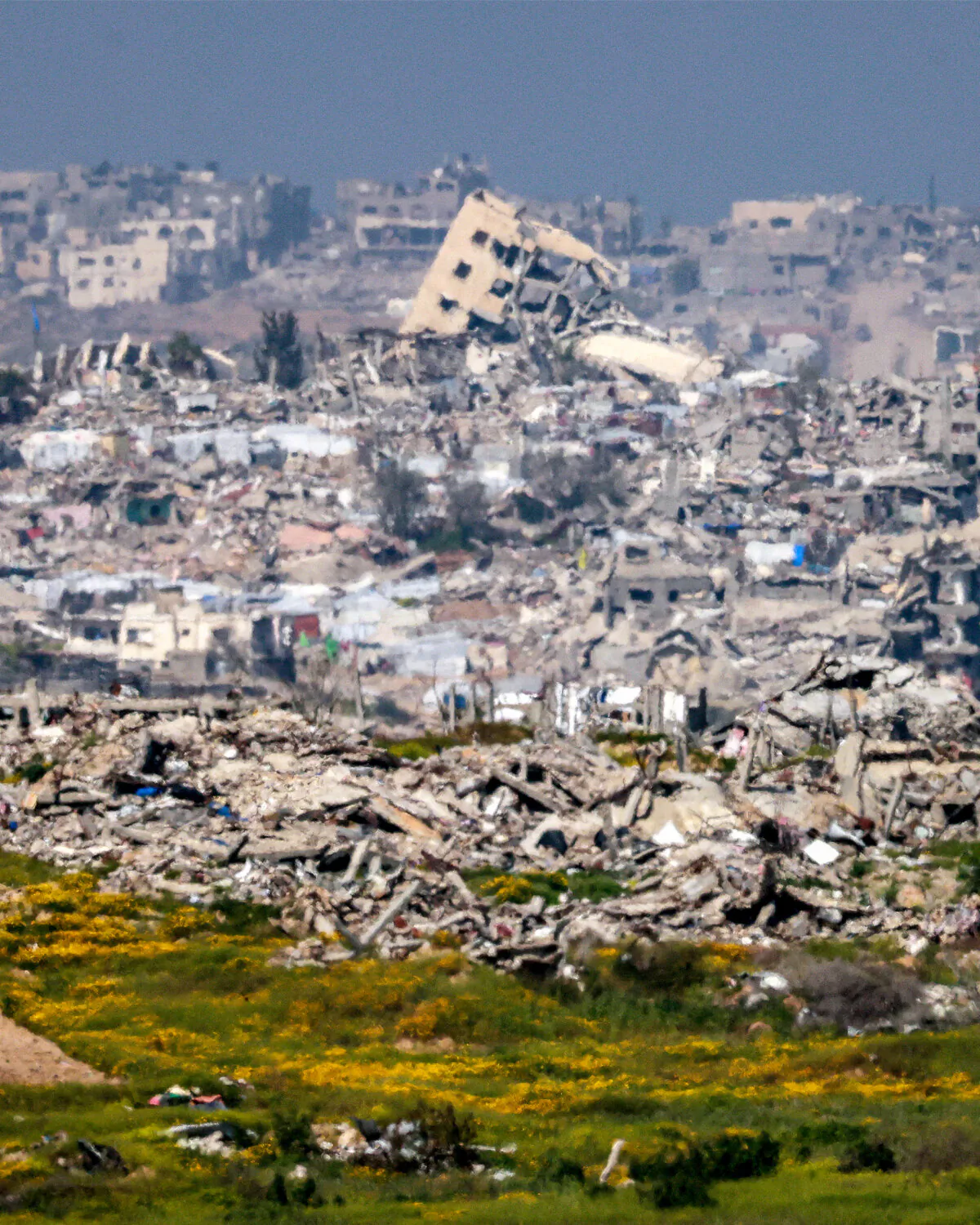 Destroyed buildings are pictured in the northern Gaza Strip from across the border in southern Israel, on March 18, 2025. (Menahem Kahana/AFP via Getty Images)