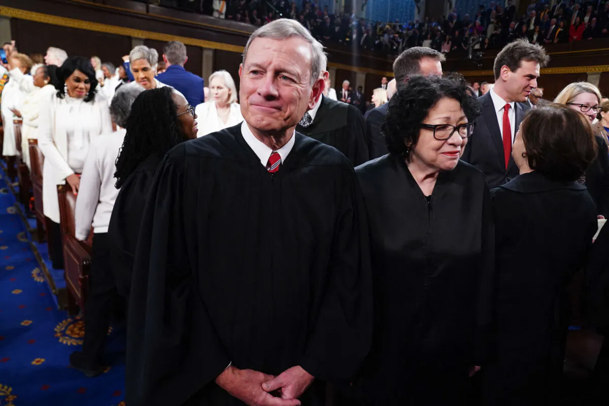 Chief Justice John Roberts (L) and Supreme Court Associate Justice Sonia Sotomayor (R) stand in the House of Representatives ahead of President Joe Biden's State of the Union address in the House Chamber of the U.S. Capitol on March 7, 2024. (Shawn Thew/Pool/AFP via Getty Images)