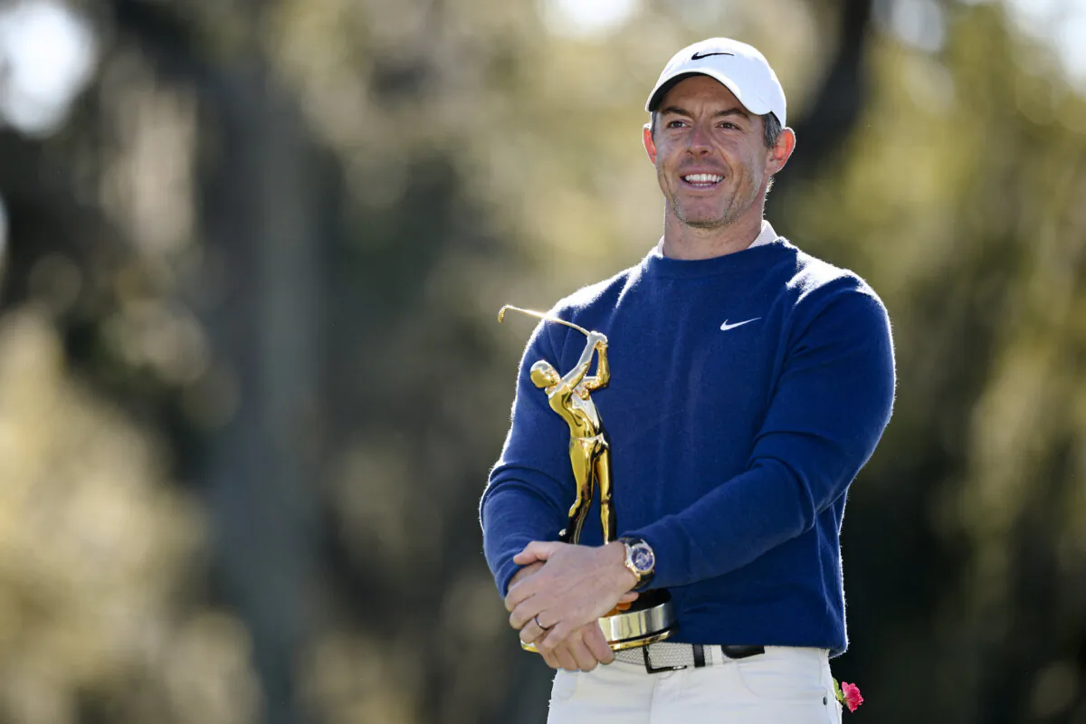 Rory McIlroy of Northern Ireland celebrates with the trophy after winning the playoff in the final round of The Players Championship on the Stadium Course at TPC Sawgrass in Ponte Vedra Beach, Florida, on March 17, 2025. (Jared C. Tilton/Getty Images)