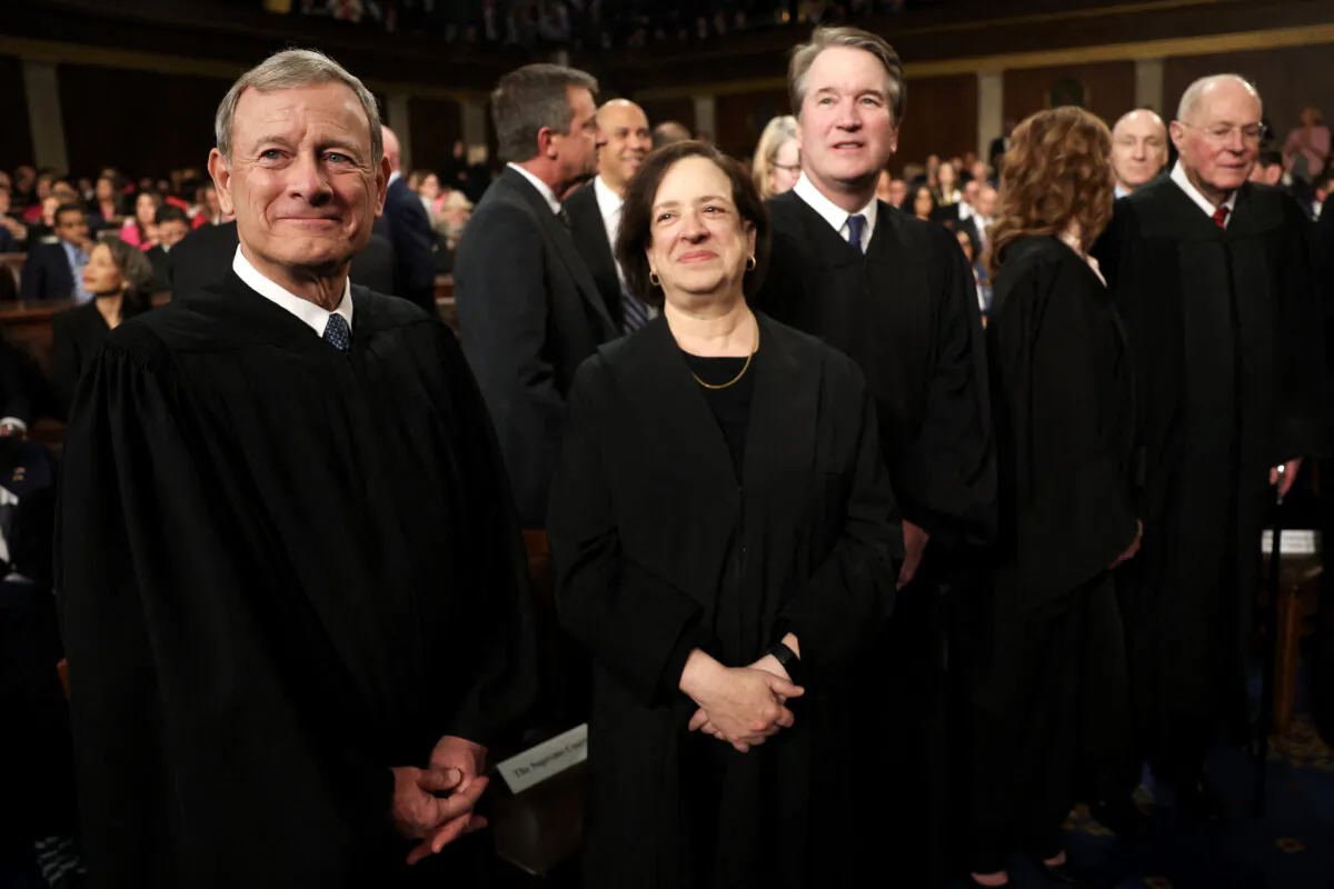 (L–R) Chief Justice John Roberts, Supreme Court Associate Justice Elena Kagan, and Associate Justice Brett Kavanaugh attend President Donald Trump's address to a joint session of Congress at the U.S. Capitol in Washington on March 4, 2025. (Win McNamee/Pool/AFP via Getty Images)