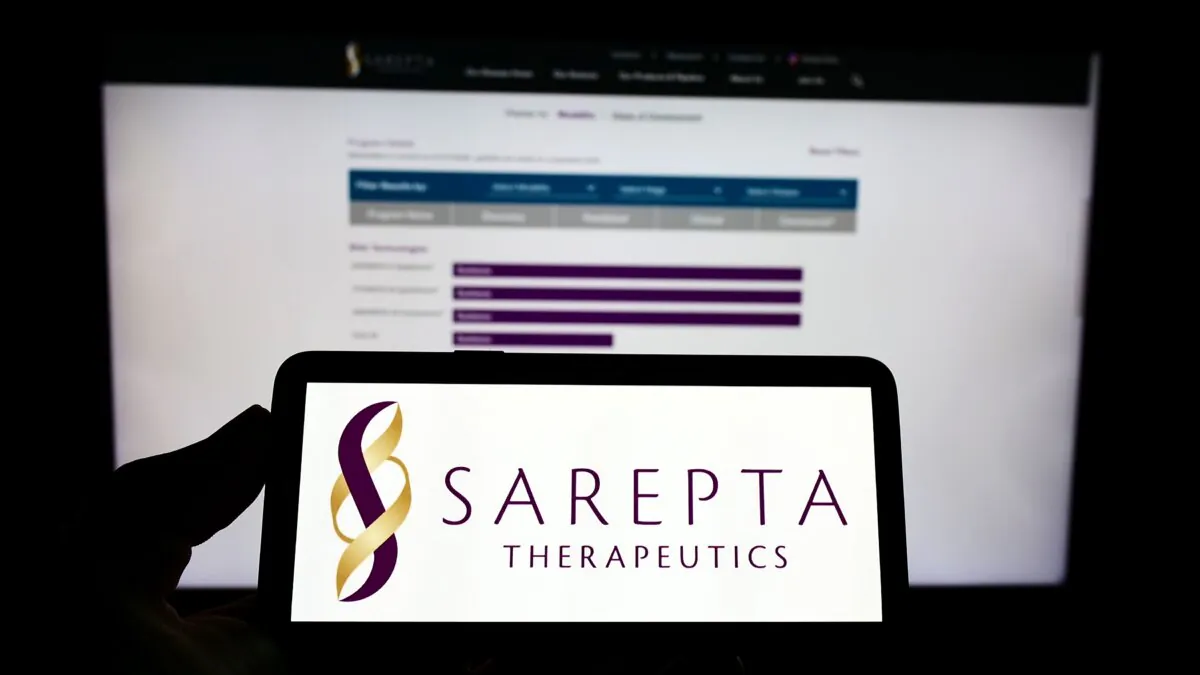 A mobile phone with the logo of Sarepta Therapeutics on screen in front of a web page in Stuttgart, Germany, on July 16, 2022. (Shutterstock)