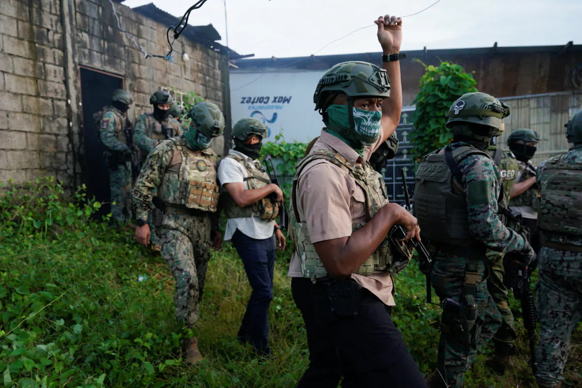 Ecuadorian security forces participate in a joint operation to search for drugs and weapons in a low-income neighborhood, in Duran, Ecuador, on March 14, 2025. (Santiago Arcos/Reuters)