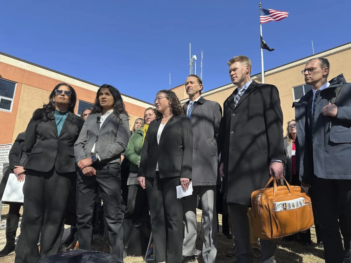 Greenpeace representatives talk with reporters outside the Morton County Courthouse in Mandan, N.D., on March 19, 2025. 9Jack Dura)