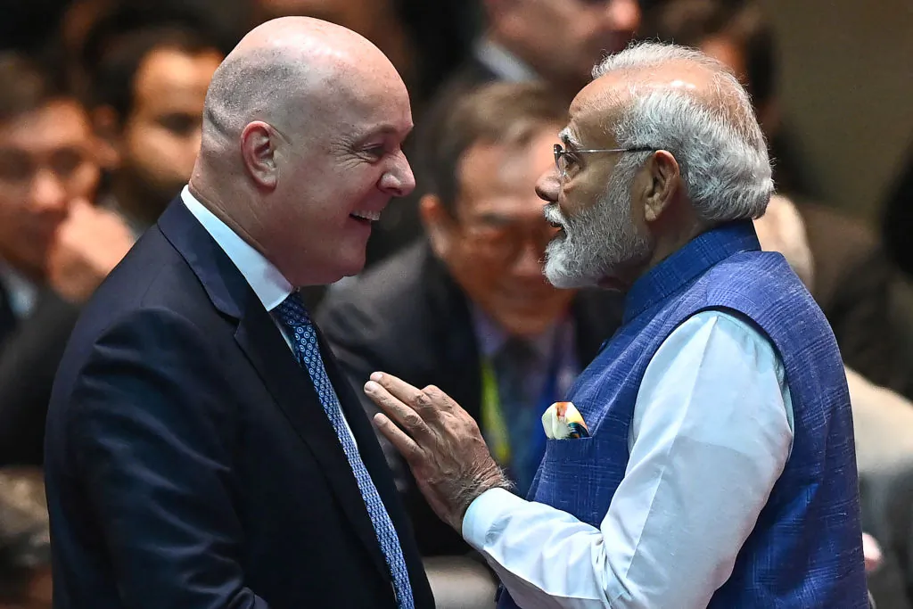 India's Prime Minister Narendra Modi (R) speaks with New Zealand's Prime Minister Christopher Luxon (L) at the 19th East Asia Summit during the 44th and 45th Association of Southeast Asian Nations (ASEAN) Summits in Vientiane on Oct. 11, 2024. (Nhac Nguyen/AFP via Getty Images)