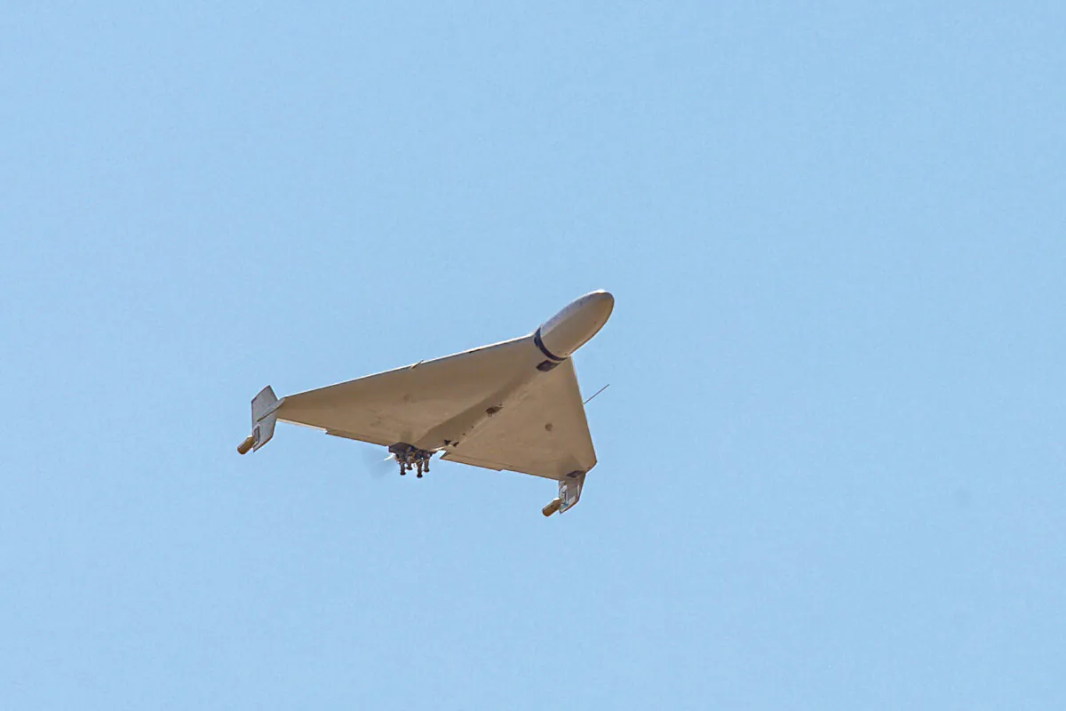 An Iranian-made Shahed-136 'Kamikaze' drone flies over the sky of Kermanshah, Iran, on March 7, 2024. (Middle East Images via AFP via Getty images)