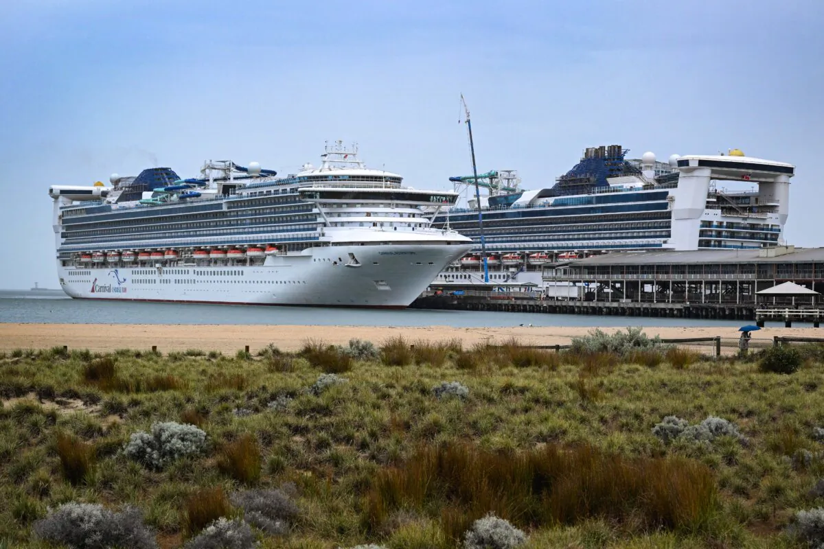 The Carnival Adventure cruise ship (L) moored at Melbourne's Station Pier on March 20, 2025. (William West/AFP via Getty Images)