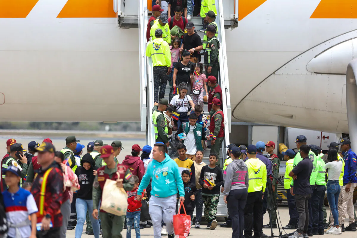 Venezuelan migrants walk down a plane upon arrival at Simon Bolivar International Airport in Maiquetia, Venezuela, on March 20, 2025. (Pedro Mattey/AFP via Getty Images)