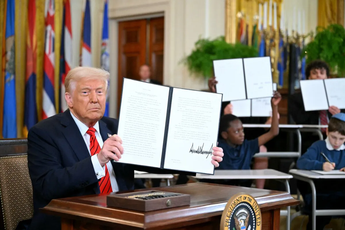 President Donald Trump holds an executive order dismantling the U.S. Department of Education, in Washington on March 20, 2025. (Mandel Ngan/AFP via Getty Images)