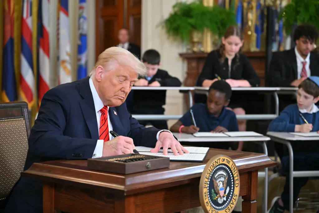 President Donald Trump signs an executive order in the East Room of the White house on March 20, 2025. (Mandel Ngan/AFP via Getty Images)