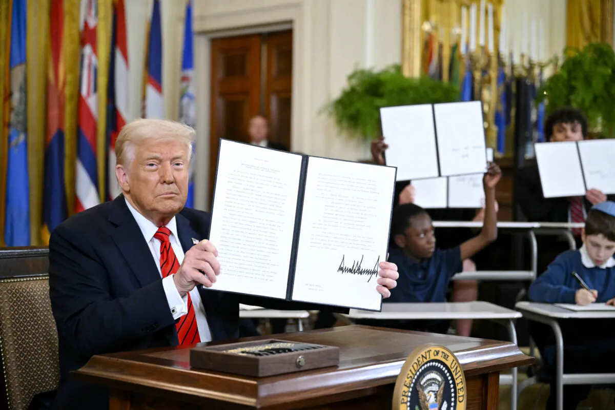 President Donald Trump holds an executive order dismantling the U.S. Department of Education, in Washington on March 20, 2025. (Mandel Ngan/AFP via Getty Images)