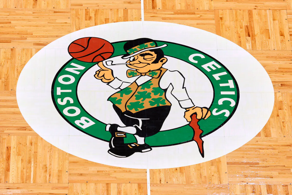 The Boston Celtics logo at center court on the parquet floor before an NBA basketball game between the Celtics and the Atlanta Hawks in Boston on Feb. 13, 2022. (Winslow Townson/AP Photo)