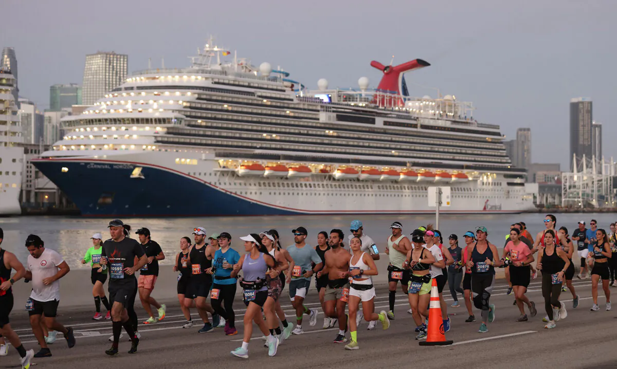 Runners run eastward passing the Carnival Horizon docked at the Port of Miami during Life Time Miami Marathon on Sunday, January 28, 2024, in Miami, Florida. (Carl Juste/Miami Herald/TNS) 