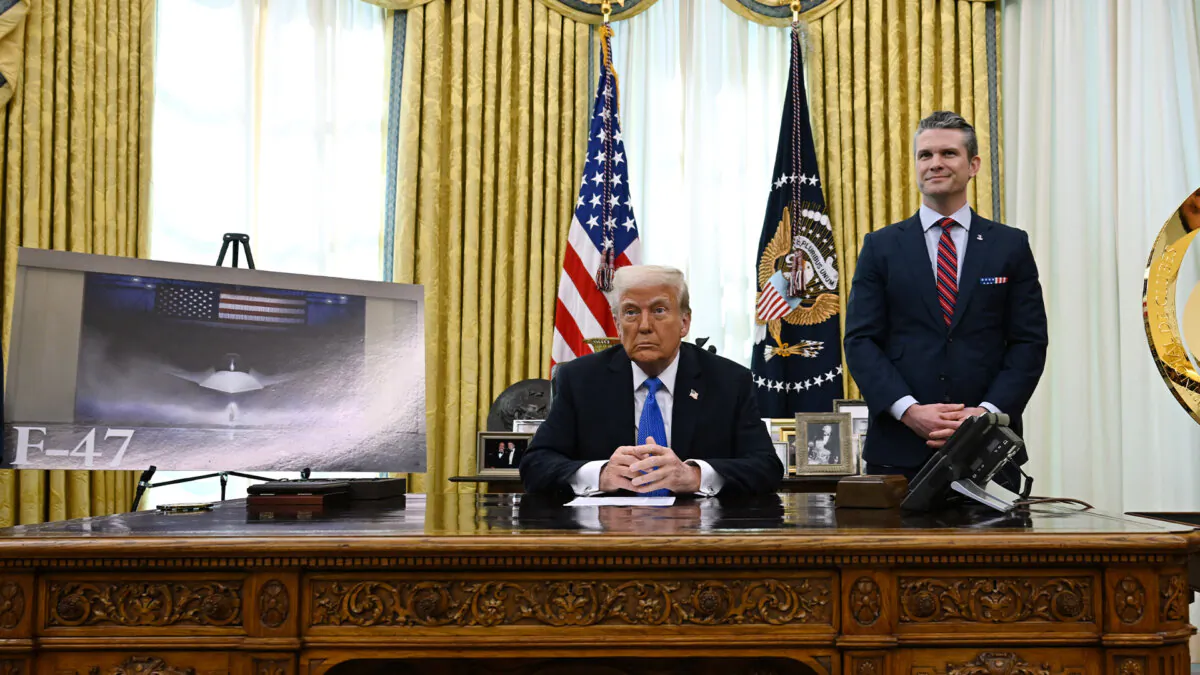 U.S. President Donald Trump and Secretary of Defense Pete Hegseth listen during an event in the Oval Office of the White House in Washington, DC, on March 21, 2025. (Annabelle Gordon/AFP via Getty Images)