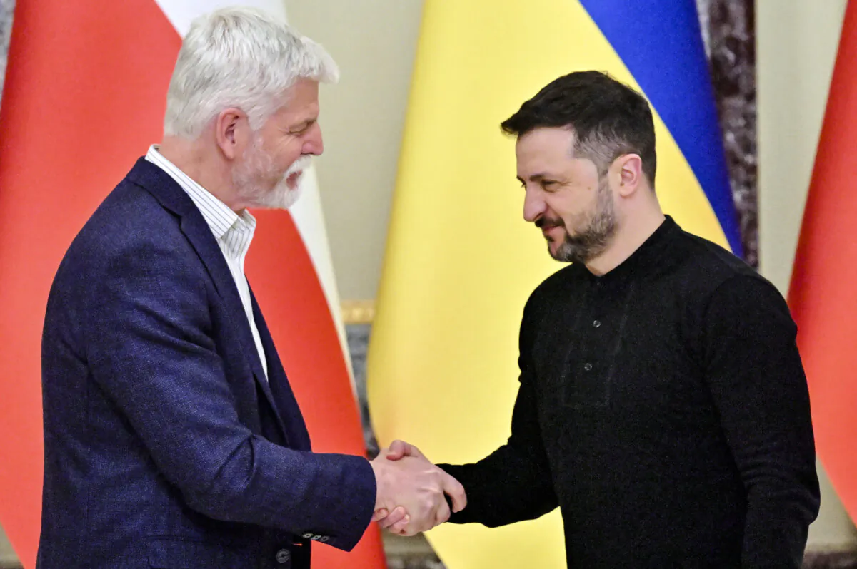 Ukraine's President Volodymyr Zelensky (R) and Czech President Petr Pavel shake hands after a press conference following talks in Kyiv, Ukraine, on March 21, 2025. (Sergei Supinsky/AFP via Getty Images)