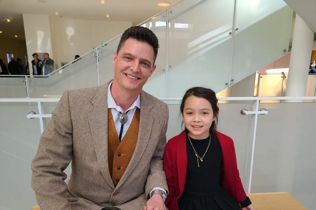 Chris Arnold (L) enjoyed Shen Yun's matinee at the George S. and Dolores Doré Eccles Theater on March 23, 2025. (Lily Yu/The Epoch Times)