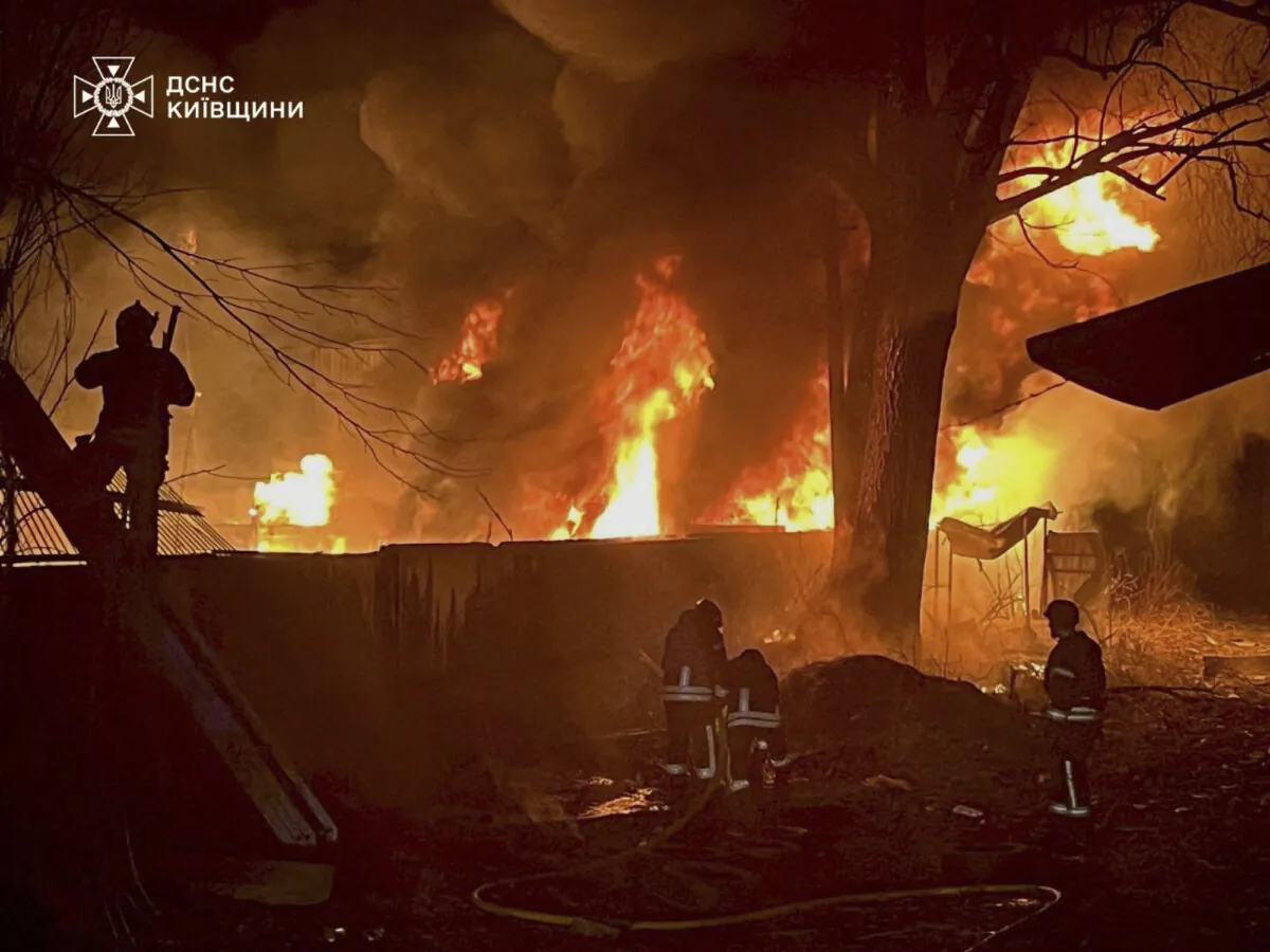 Firefighters tackle flames following a Russian attack near Kyiv, Ukraine, on March 23, 2025. (Ukrainian Emergency Service via AP)
