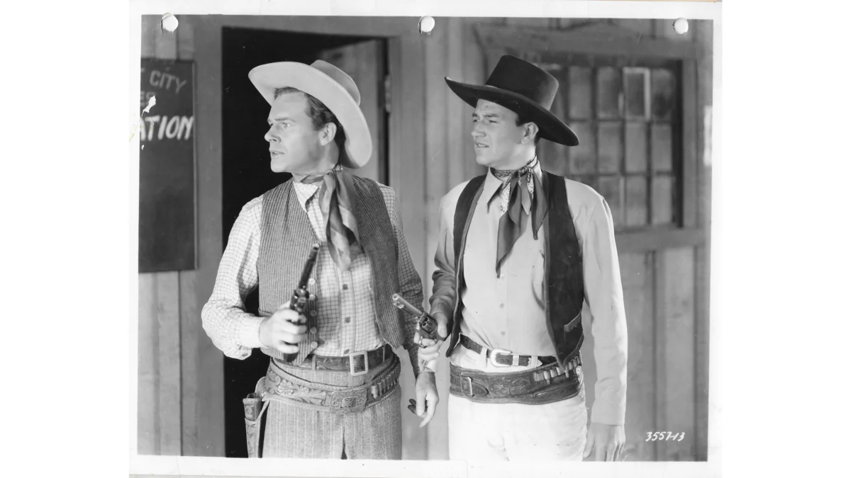 Larry Adams (Lane Chandler) and John Blair (John Wayne) keep in step with big changes in the Old West, in "Winds of the Wasteland." (Republic Pictures)