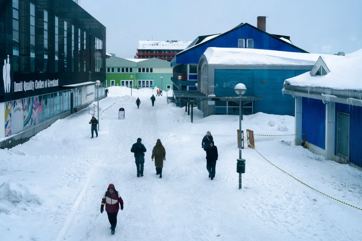 People walk on a street in Nuuk, Greenland, on March 24, 2025. Greenland's Prime Minister Mute Egede accused Washington of interfering in its political affairs with the planned visit of a U.S. delegation to the Danish territory. (Juliette Pavy/AFP via Getty Images)