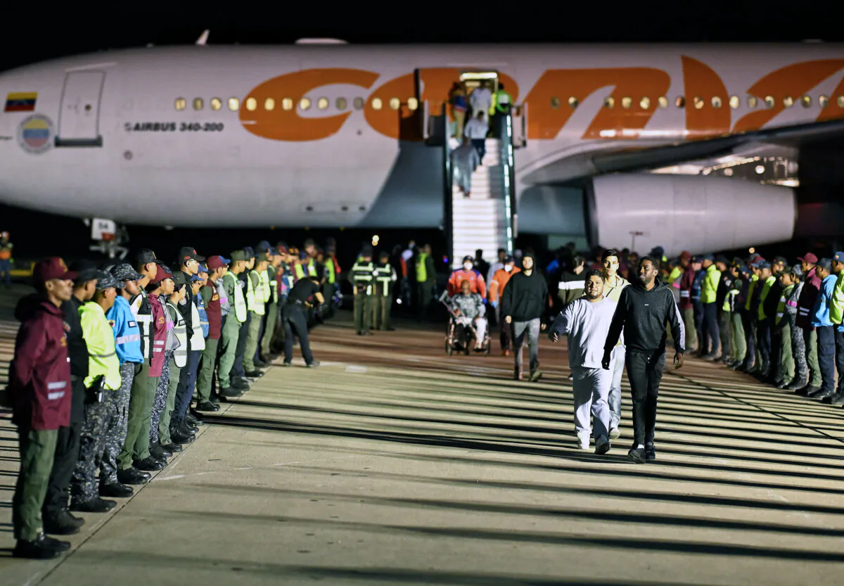 Venezuelan illegal immigrants deported from the United States disembark from a Conviasa Airlines plane at Simon Bolivar International Airport in Maiquetia, Venezuela, on March 24, 2025. (Juan Barreto/AFP via Getty Images)