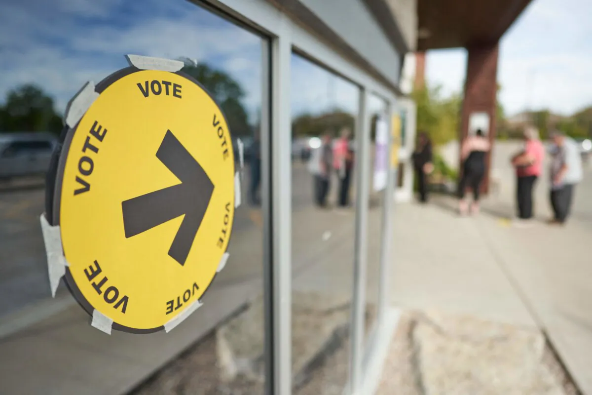 Voters enter a polling station for voting in the 2021 federal election in Oshawa, Ont., on Sept. 20, 2021. (Geoff Robins/AFP via Getty Images)