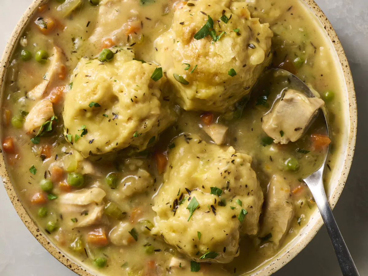 It doesn't get more comforting than creamy chicken soup topped with pillow-soft dumplings. (Alex Lepe/TCA)