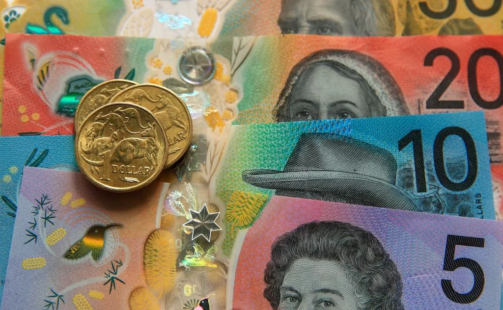 In this photo illustration, Australian $50, $20, $10 and $5 banknotes and dollar coins are shown arranged for a photograph in Newcastle, Australia on March 25, 2025. (Roni Bintang/Getty Images)