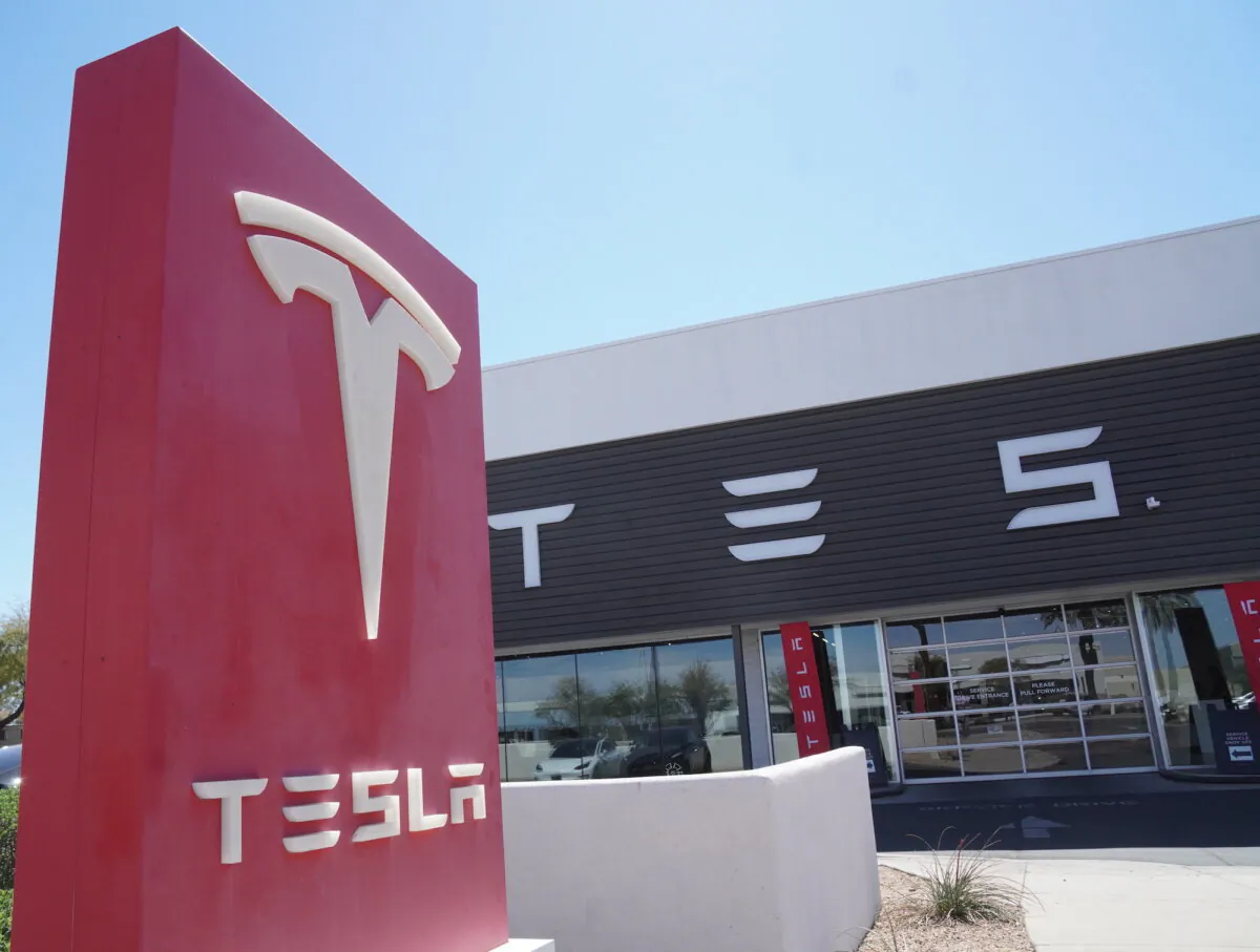 A Tesla showroom in Tempe, Ariz., where more than 50 people gathered to protest against billionaire Elon Musk's involvement in government on March 22, 2025. (Allan Stein/The Epoch Times)