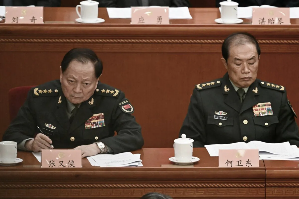 He Weidong (R), second-ranked vice chairman of China's Central Military Commission (CMC), and Zhang Youxia, first-ranked vice chairman of the CMC, attend the opening ceremony of the Chinese People's Political Consultative Conference (CPPCC) at the Great Hall of the People in Beijing on March 4, 2025. (Pedro Pardo/AFP via Getty Images)
