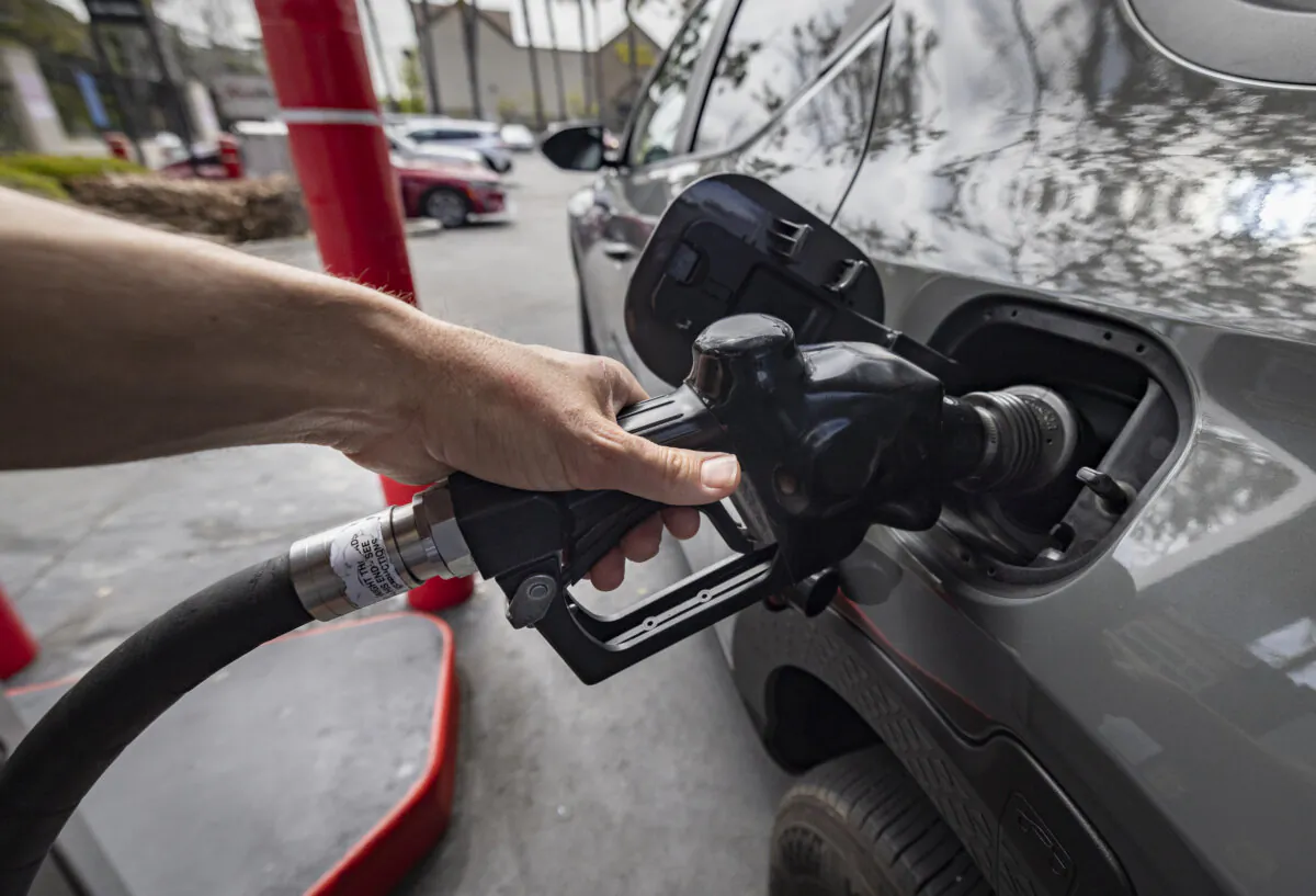Customers use a gas station in Inglewood, Calif., on March 25, 2025. (John Fredricks/The Epoch Times)