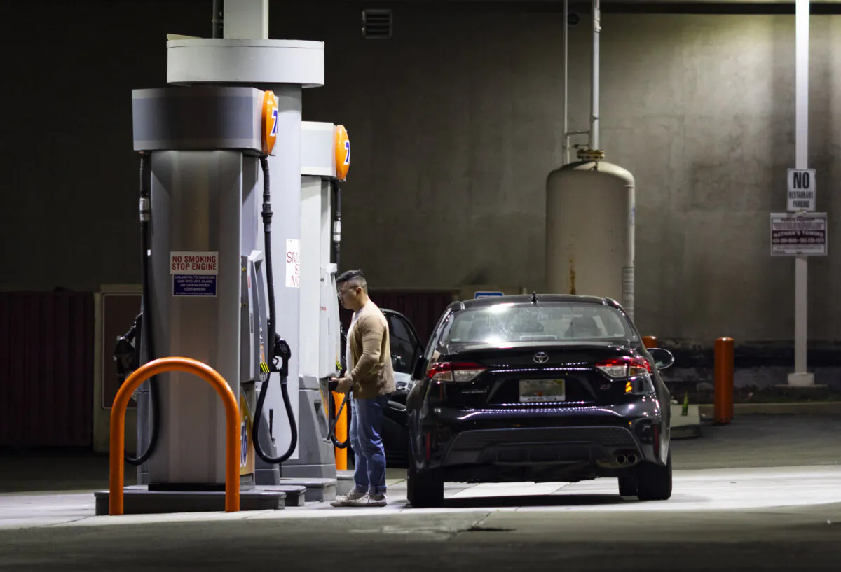 Customers use a gas station in Los Angeles on March 25, 2025. (John Fredricks/The Epoch Times)