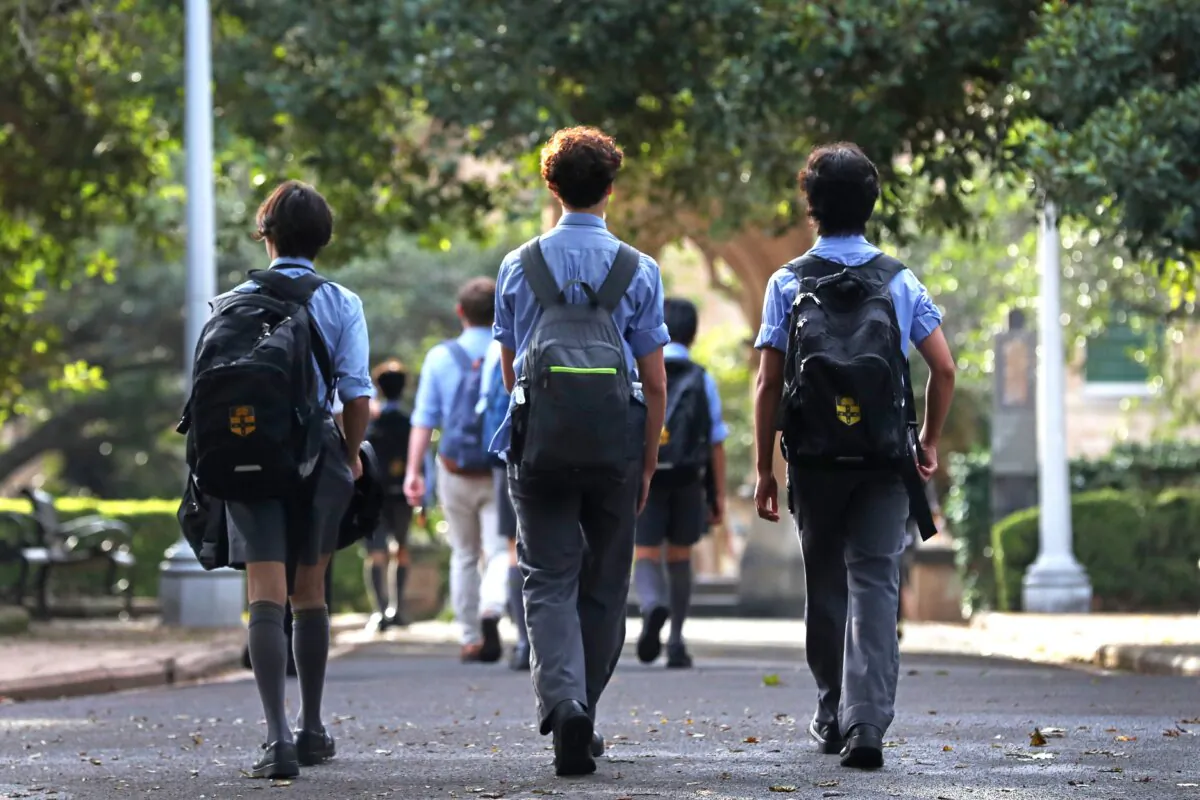 School students make their way through the Sydney central business district (CBD) in Australia on March 26, 2025. (Lisa Maree Williams/Getty Images)