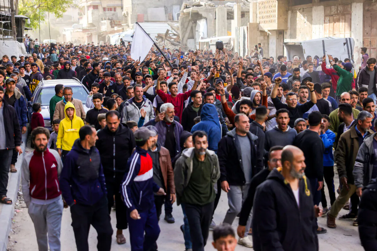 Hundreds of Palestinians attend a rally calling for an end to the war, chanting anti-Hamas slogans, in Beit Lahiya, in the northern Gaza Strip, on March 25, 2025. (AFP via Getty Images)